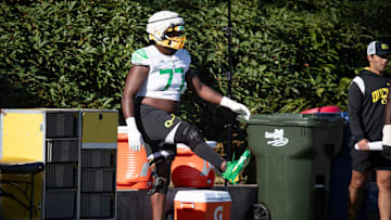 Oregon offensive lineman Matthew Bedford stretches during practice with the Oregon Ducks Wednesday, Aug. 28, 2024 at the Hatfield-Dowlin Complex in Eugene, Ore.