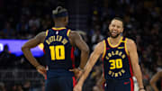 Mar 13, 2025; San Francisco, California, USA; Golden State Warriors forward Jimmy Butler III (10) and guard Stephen Curry (30) share a laugh during the second quarter against the Sacramento Kings at Chase Center. Mandatory Credit: D. Ross Cameron-Imagn Images