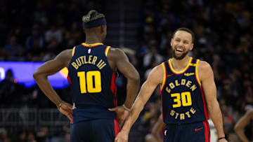 Mar 13, 2025; San Francisco, California, USA; Golden State Warriors forward Jimmy Butler III (10) and guard Stephen Curry (30) share a laugh during the second quarter against the Sacramento Kings at Chase Center. Mandatory Credit: D. Ross Cameron-Imagn Images