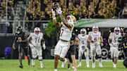 Oct 4, 2025; Orlando, Florida, USA; Kansas Jayhawks wide receiver Cam Pickett (7) jumps for a pass during the second half against the UCF Knights at FBC Mortgage Stadium. Mandatory Credit: Mike Watters-Imagn Images