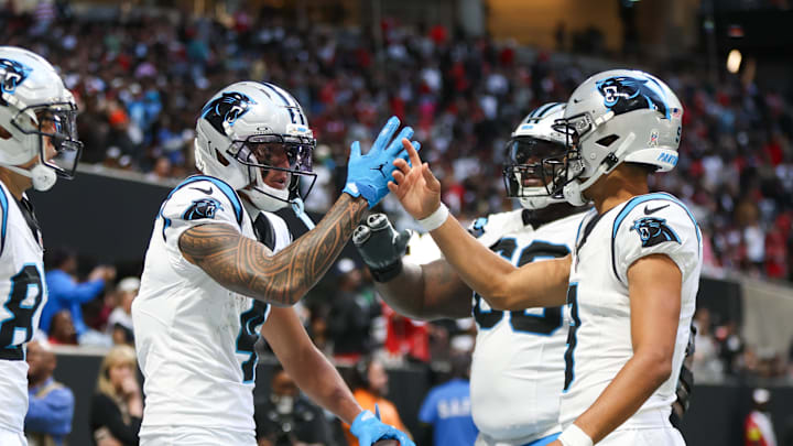 Nov 16, 2025; Atlanta, Georgia, USA; Carolina Panthers quarterback Bryce Young (9) shakes hands with wide receiver Tetairoa McMillan (4) after a touchdown in the fourth quarter against the Atlanta Falcons at Mercedes-Benz Stadium. Mandatory Credit: Brett Davis-Imagn Images