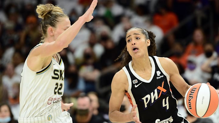Oct 10, 2021; Phoenix, Arizona, USA; Phoenix Mercury guard Skylar Diggins-Smith (4) dribbles against Chicago Sky guard Courtney Vandersloot (22) during the first half of game one of the 2021 WNBA Finals at Footprint Center. Mandatory Credit: Joe Camporeale-Imagn Images