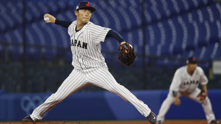 Aug 4, 2021; Yokohama, Japan; Team Japan pitcher Yoshinobu Yamamoto (17) throws a pitch against