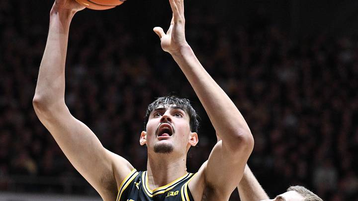 Feb 17, 2026; West Lafayette, Indiana, USA;  Michigan Wolverines center Aday Mara (15) shoots the ball over Purdue Boilermakers center Oscar Cluff (45) during the first half at Mackey Arena. Mandatory Credit: Marc Lebryk-Imagn Images