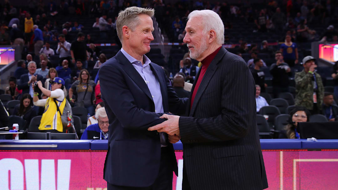 Nov 1, 2019; San Francisco, CA, USA; Golden State Warriors head coach Steve Kerr and San Antonio Spurs head coach Gregg Popovich meet after the game at the Chase Center. Mandatory Credit: Cary Edmondson-Imagn Images