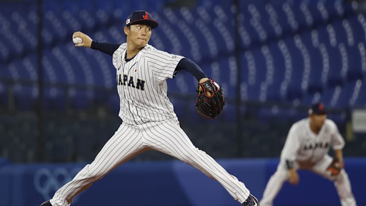 Aug 4, 2021; Yokohama, Japan; Team Japan pitcher Yoshinobu Yamamoto (17) throws a pitch against