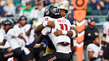 Notre Dame defensive lineman Boubacar Traore, right, sacks NC State quarterback CJ Bailey (11) in the first half of a NCAA football game at Notre Dame Stadium on Saturday, Oct. 11, 2025, in South Bend.