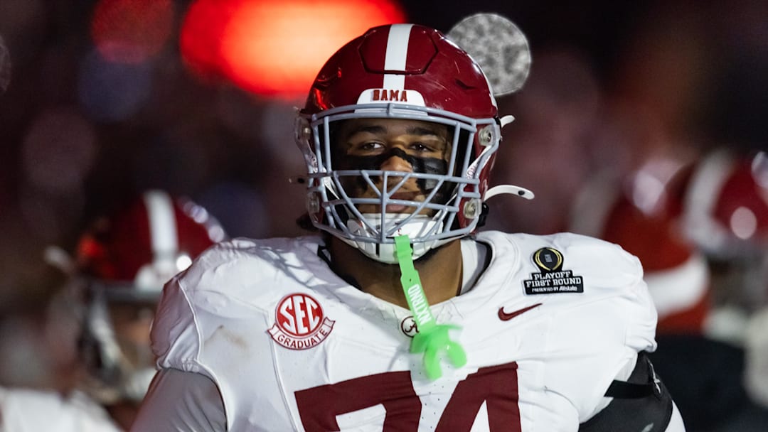 Dec 19, 2025; Norman, OK, USA; Alabama Crimson Tide offensive lineman Kadyn Proctor (74) against the Oklahoma Sooners during the CFP National Playoff First Round at Gaylord Family Oklahoma Memorial Stadium. Mandatory Credit: Mark J. Rebilas-Imagn Images Dec 19, 2025; Norman, OK, USA; Alabama Crimson Tide offensive lineman Kadyn Proctor (74) against the Oklahoma Sooners during the CFP National Playoff First Round at Gaylord Family Oklahoma Memorial Stadium. Mandatory Credit: Mark J. Rebilas-Imagn Images