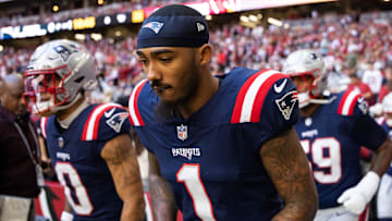 Dec 15, 2024; Glendale, Arizona, USA; New England Patriots wide receiver Ja'Lynn Polk (1) against the Arizona Cardinals at State Farm Stadium. Mandatory Credit: Mark J. Rebilas-Imagn Images