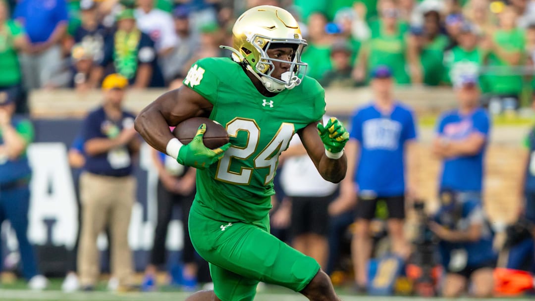 Notre Dame Fighting Irish running back Jadarian Price runs the ball against the Boise State Broncos at Notre Dame Stadium.
