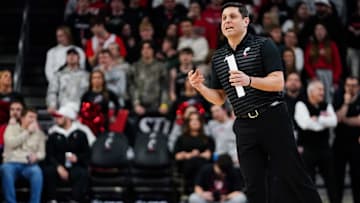 Cincinnati Bearcats head coach Wes Miller speaks out to players in the first half of a NCAA men’s basketball game between the Cincinnati Bearcats and Utah Utes, Tuesday, Feb. 11, 2025, at Fifth Third Arena in Cincinnati.