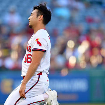 Jul 7, 2025; Anaheim, California, USA; Los Angeles Angels pitcher Yusei Kikuchi (16) reacts after trying to field the single of Texas Rangers designated hitter Sam Haggerty (0) during the first inning at Angel Stadium. Mandatory Credit: Gary A. Vasquez-Imagn Images