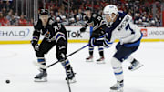 Feb 1, 2025; Washington, District of Columbia, USA; Winnipeg Jets center Vladislav Namestnikov (7) shoots the puck as Washington Capitals defenseman John Carlson (74) defends in the second period at Capital One Arena. Mandatory Credit: Geoff Burke-Imagn Images
