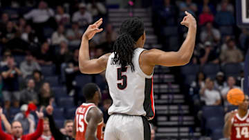 Mar 12, 2025; Nashville, TN, USA;  Georgia Bulldogs guard Silas Demary Jr. (5) reacts after a made three-point basket against the Oklahoma Sooners during the second half at Bridgestone Arena.