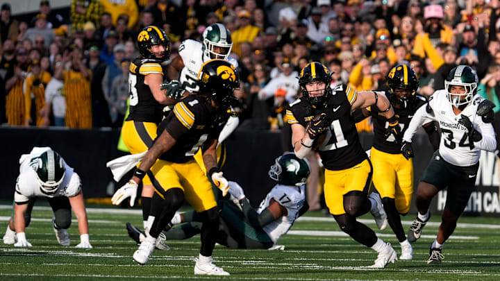 Iowa Hawkeyes wide receiver Kaden Wetjen (21) returns a punt to the endzone against the Michigan State Spartans Nov. 22, 2025 at Kinnick Stadium in Iowa City, Iowa.