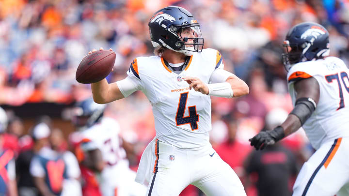 Aug 25, 2024; Denver, Colorado, USA; Denver Broncos quarterback Zach Wilson (4) prepares to pass in the second quarter against the Arizona Cardinals at Empower Field at Mile High. 