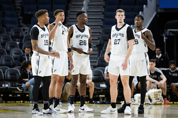 The San Antonio Spurs' Summer League squad huddles during a timeout against the Los Angeles Lakers during the California Clas