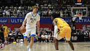Jul 10, 2025; Las Vegas, NV, USA; Dallas Mavericks forward Cooper Flagg (32) dribbles against Los Angeles Lakers guard Bronny James (9) in the first quarter of their game at Thomas & Mack Center. Mandatory Credit: Candice Ward-Imagn Images