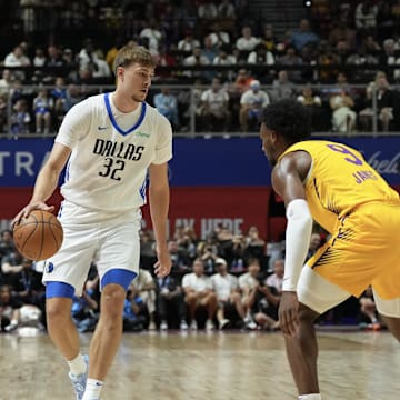 Jul 10, 2025; Las Vegas, NV, USA; Dallas Mavericks forward Cooper Flagg (32) dribbles against Los Angeles Lakers guard Bronny James (9) in the first quarter of their game at Thomas & Mack Center. Mandatory Credit: Candice Ward-Imagn Images