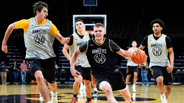 Iowa’s Bennett Stirtz (14) drives to the basket as Tate Sage (24) defends during practice Oct. 15, 2025 at Carver-Hawkeye Arena in Iowa City, Iowa.