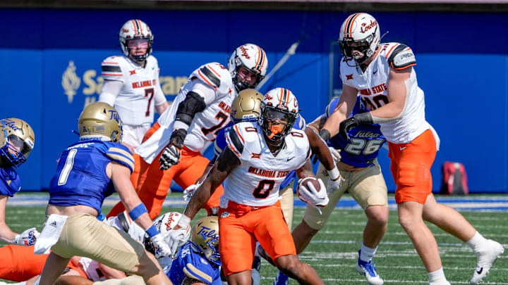 Oklahoma State running back Ollie Gordon II (0) runs the ball in the first half during an NCAA football game between Oklahoma State and Tulsa in Tulsa, Okla., on Saturday, Sept. 14, 2024.