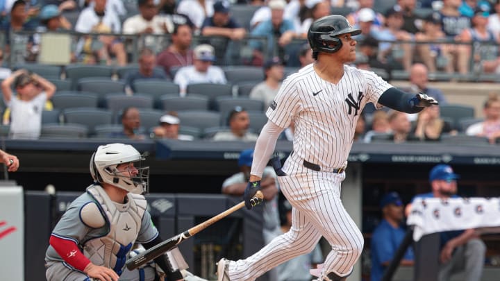 Aug 4, 2024; Bronx, New York, USA; New York Yankees right fielder Juan Soto (22) hits a solo home run during the seventh inning against the Toronto Blue Jays at Yankee Stadium.