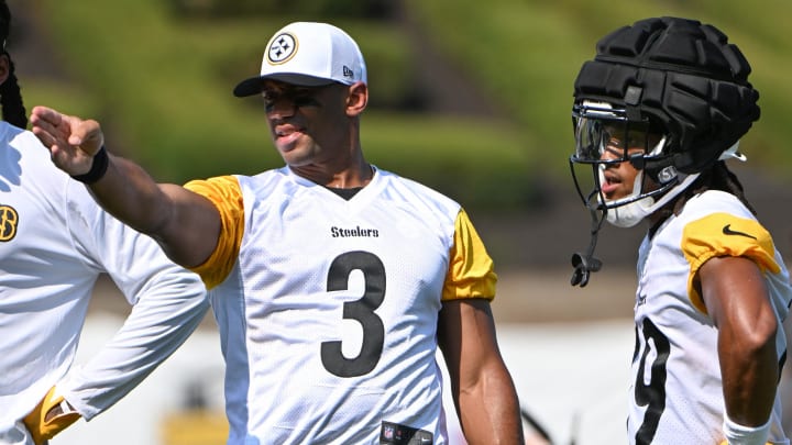 Jul 28, 2024; Latrobe, PA, USA; Pittsburgh Steelers quarterback Russell Wilson (3) talks to wide receiver Calvin Austin III (19) during training camp at Saint Vincent College. Mandatory Credit: Barry Reeger-USA TODAY Sports