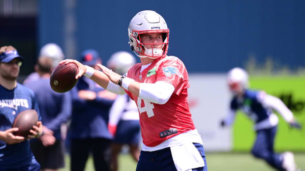 New England Patriots quarterback Bailey Zappe (4) throws a pass at minicamp at Gillette Stadium.