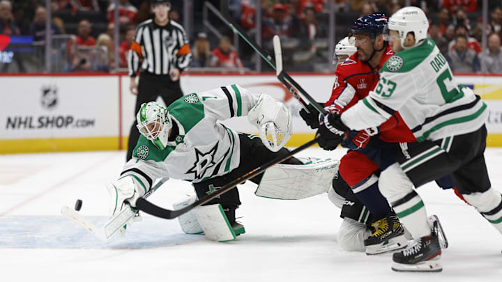 Oct 17, 2024; Washington, District of Columbia, USA; Washington Capitals left wing Alex Ovechkin (8) and Dallas Stars right wing Evgenii Dadonov (63) battles for the puck in front of Stars goaltender Casey DeSmith (1) in the third period at Capital One Arena. Mandatory Credit: Geoff Burke-Imagn Images