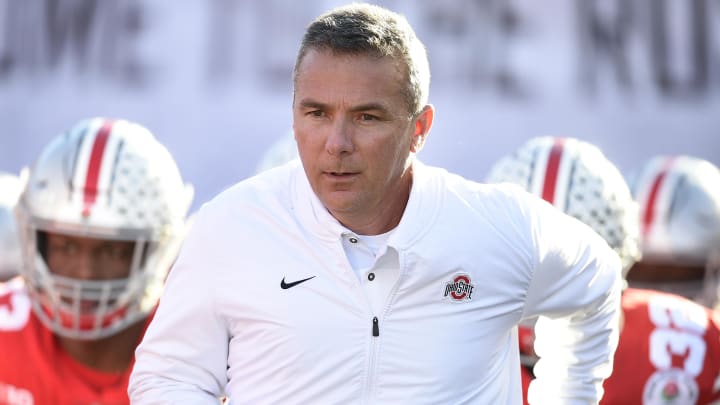 Ohio State Buckeyes head coach Urban Meyer leads his team onto the field at the Rose Bowl Game.