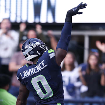 Nov 9, 2025; Seattle, Washington, USA; Seattle Seahawks defensive end DeMarcus Lawrence (0) celebrates after recovering a fumble to score a touchdown during the second quarter against the Arizona Cardinals at Lumen Field.