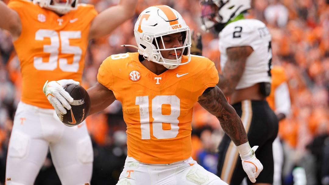 Tennessee running back DeSean Bishop (18) and wide receiver Ben Petermann (35) celebrate after Bishop scores a touchdown in an NCAA college football game against Vanderbilt on Nov. 29, 2025, in Knoxville, Tennessee.