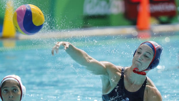 United States player Maggie Steffens (6) throws the ball against Spain during a women's water polo preliminary round game.