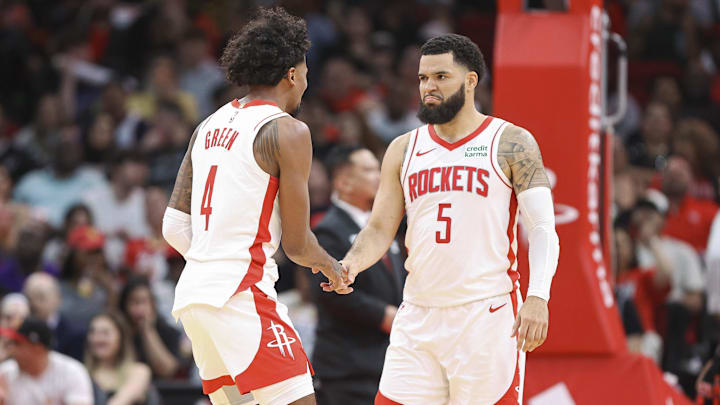 Mar 5, 2024; Houston, Texas, USA; Houston Rockets guard Jalen Green (4) celebrates with guard Fred VanVleet (5) after a play during the second half against the San Antonio Spurs at Toyota Center. Mandatory Credit: Troy Taormina-Imagn Images