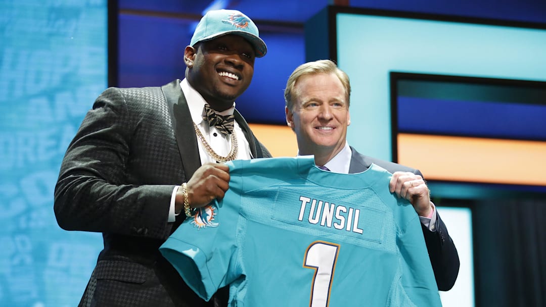 Laremy Tunsil  with NFL commissioner Roger Goodell after being selected by the Miami Dolphins as the No.13 overall pick in the first round of the 2016 NFL Draft at Auditorium Theatre.