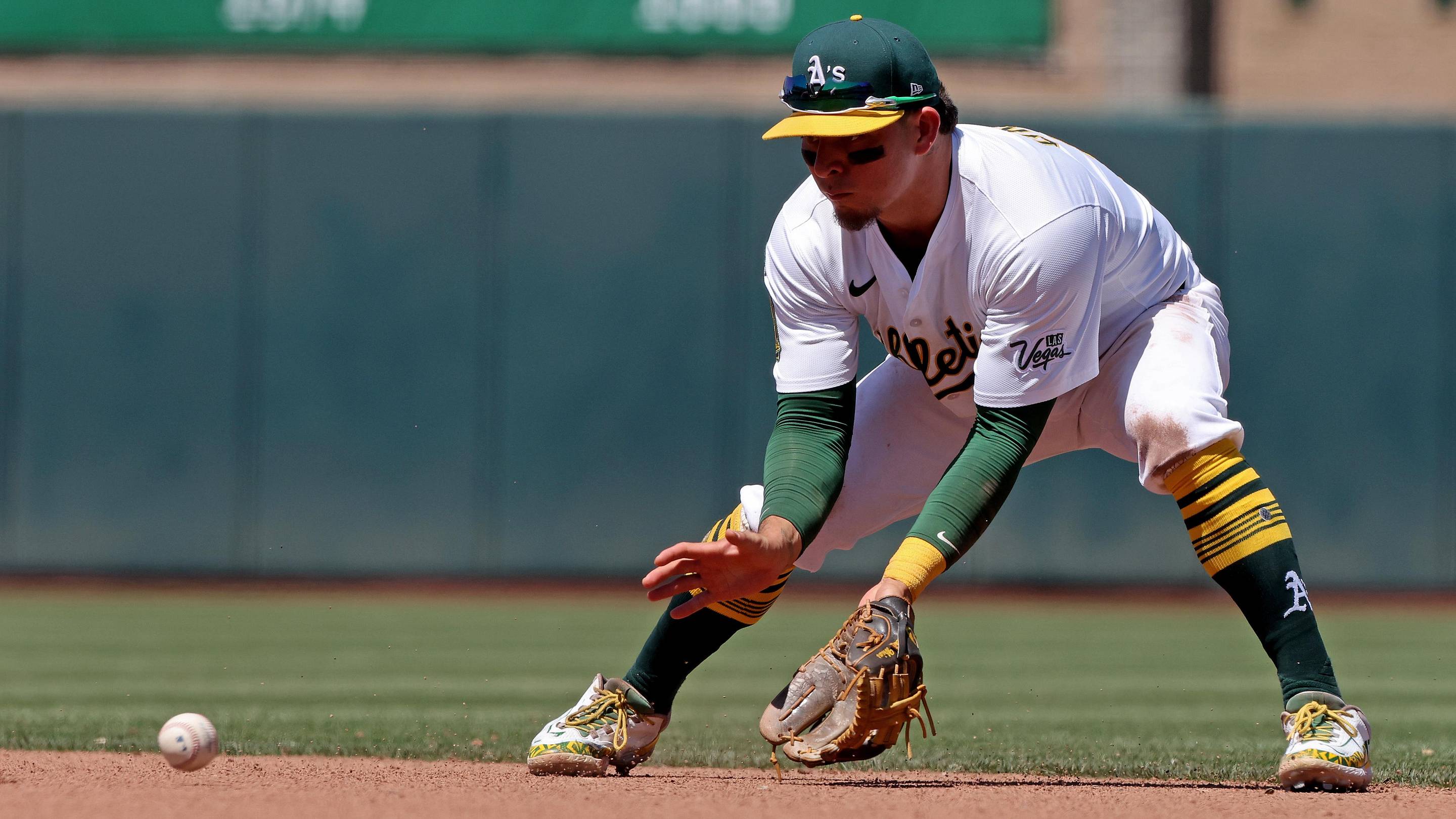 Jun 22, 2025; West Sacramento, California, USA; Athletics second baseman Luis Urias (17) fields a ground ball against the Cleveland Guardians during the seventh inning at Sutter Health Park. Mandatory Credit: Dennis Lee-Imagn Images