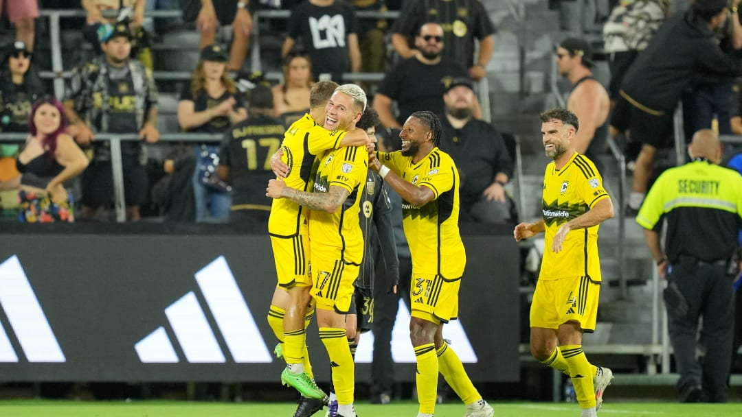 Jul 13, 2024; Los Angeles, California, USA; Columbus Crew forward Christian Ramirez (17) celebrates with teammates after scoring a goal in the second half against LAFC at BMO Stadium. Mandatory Credit: Kirby Lee-USA TODAY Sports