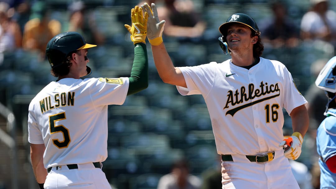Jul 13, 2025; West Sacramento, California, USA; Athletics first baseman Nick Kurtz (16) celebrates with shortstop Jacob Wilson (5) after hitting a two-run home run against the Toronto Blue Jays during the fifth inning at Sutter Health Park. Mandatory Credit: Dennis Lee-Imagn Images