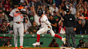 Sep 11, 2024; Boston, Massachusetts, USA; Boston Red Sox left fielder Tyler O'Neill (17) his a three run home run to win the game against the Baltimore Orioles in ten innings at Fenway Park. Mandatory Credit: David Butler II-Imagn Images