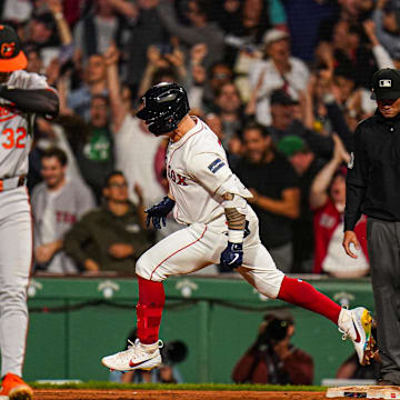 Sep 11, 2024; Boston, Massachusetts, USA; Boston Red Sox left fielder Tyler O'Neill (17) his a three run home run to win the game against the Baltimore Orioles in ten innings at Fenway Park. Mandatory Credit: David Butler II-Imagn Images