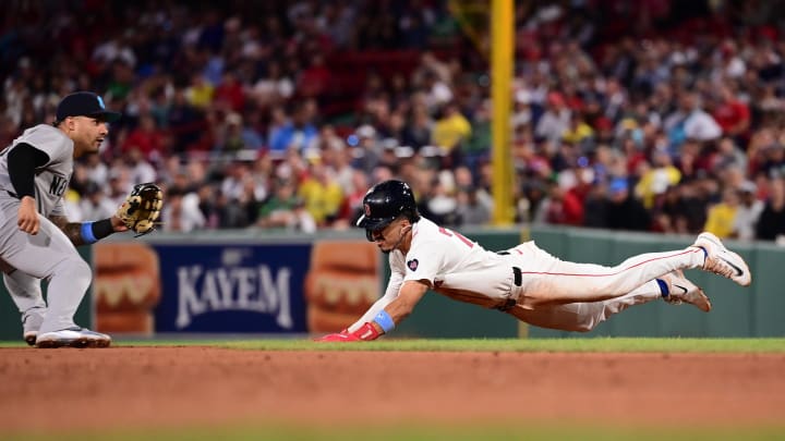 Red Sox shortstop David Hamilton steals second base  against Yankees second baseman Gleyber Torres.