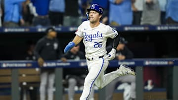 Oct 9, 2024; Kansas City, Missouri, USA; Kansas City Royals second base Adam Frazier (26) scores a run during the fifth inning against the New York Yankees in game three of the ALDS for the 2024 MLB Playoffs at Kauffman Stadium. Mandatory Credit: Jay Biggerstaff-Imagn Images