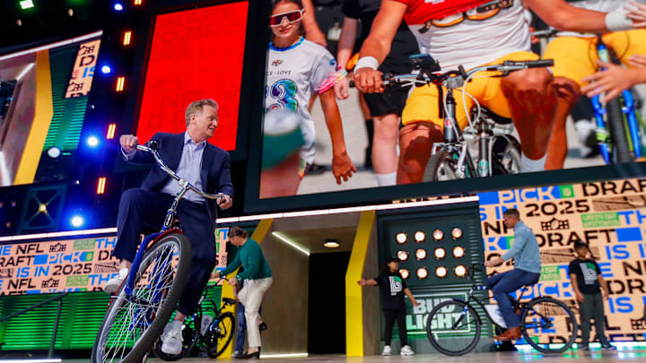 NFL Commissioner Roger Goodell rides a bicycle onto the NFL Draft Theater stage before the 2025 NFL Draft at Lambeau Field NFL Commissioner Roger Goodell rides a bicycle onto the NFL Draft Theater stage before the 2025 NFL Draft at Lambeau Field