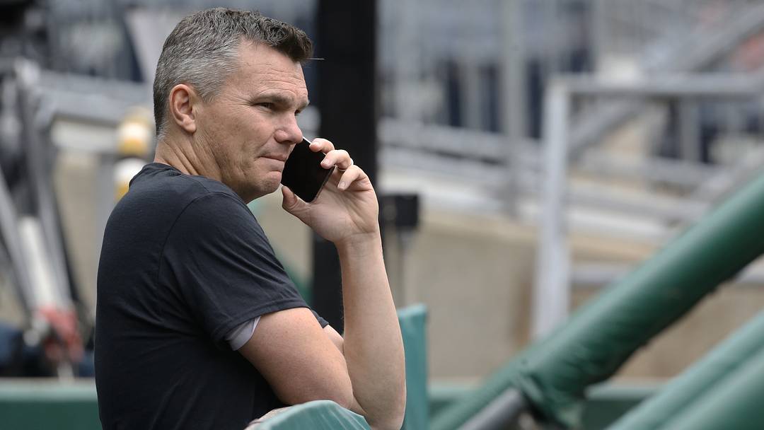 May 24, 2022; Pittsburgh, Pennsylvania, USA;  Pittsburgh Pirates general manager Ben Cherington talks on the phone in the dugout before the game against the Colorado Rockies at PNC Park. Mandatory Credit: Charles LeClaire-USA TODAY Sports