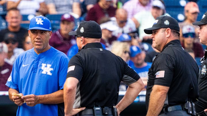 Jun 17, 2024; Omaha, NE, USA; Texas A&M Aggies head coach Jim Schlossnagle (22) and Kentucky Wildcats head coach Nick Mingione meet before the game at Charles Schwab Field Omaha. Mandatory Credit: Dylan Widger-Imagn Images