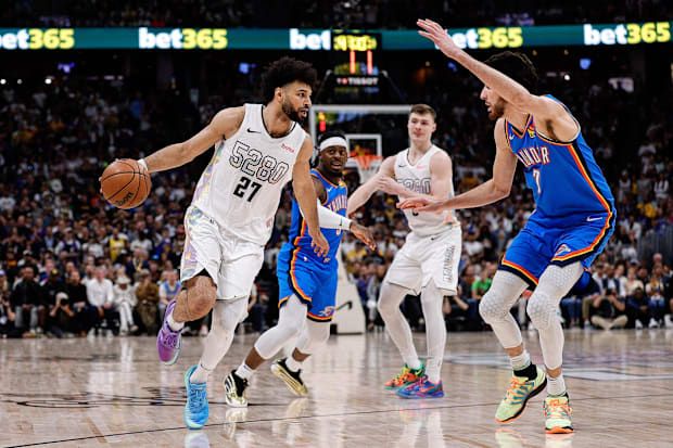 Denver Nuggets guard Jamal Murray (27) controls the ball as Oklahoma City Thunder forward Chet Holmgren (7)