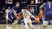 Nov 28, 2025; Charlottesville, Virginia, USA; Virginia Cavaliers guard Chance Mallory (2) dribbles the ball as Queens University of Charlotte Royals forward Carson Schwieger (22) defends during the second half at John Paul Jones Arena. Mandatory Credit: Amber Searls-Imagn Images