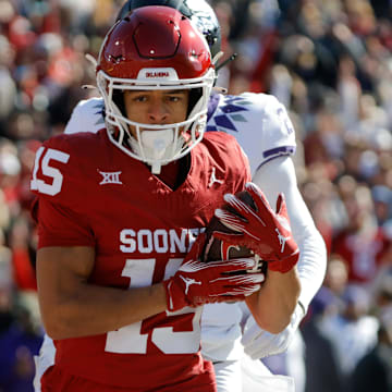 Nov 24, 2023; Norman, Oklahoma, USA; Oklahoma Sooners wide receiver Brenen Thompson (15) catches a touchdown pass against the TCU Horned Frogs at Gaylord Family-Oklahoma Memorial Stadium. Mandatory Credit: Bryan Terry-Imagn Images