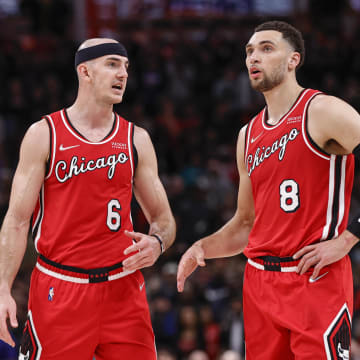 Mar 31, 2022; Chicago, Illinois, USA; Chicago Bulls guard Alex Caruso (6) talks with guard Zach LaVine (8) during overtime of an NBA game against the LA Clippers at United Center. Mandatory Credit: Kamil Krzaczynski-USA TODAY Sports