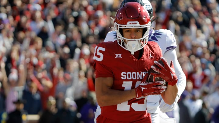 Nov 24, 2023; Norman, Oklahoma, USA; Oklahoma Sooners wide receiver Brenen Thompson (15) catches a touchdown pass against the TCU Horned Frogs at Gaylord Family-Oklahoma Memorial Stadium. Mandatory Credit: Bryan Terry-USA TODAY Sports